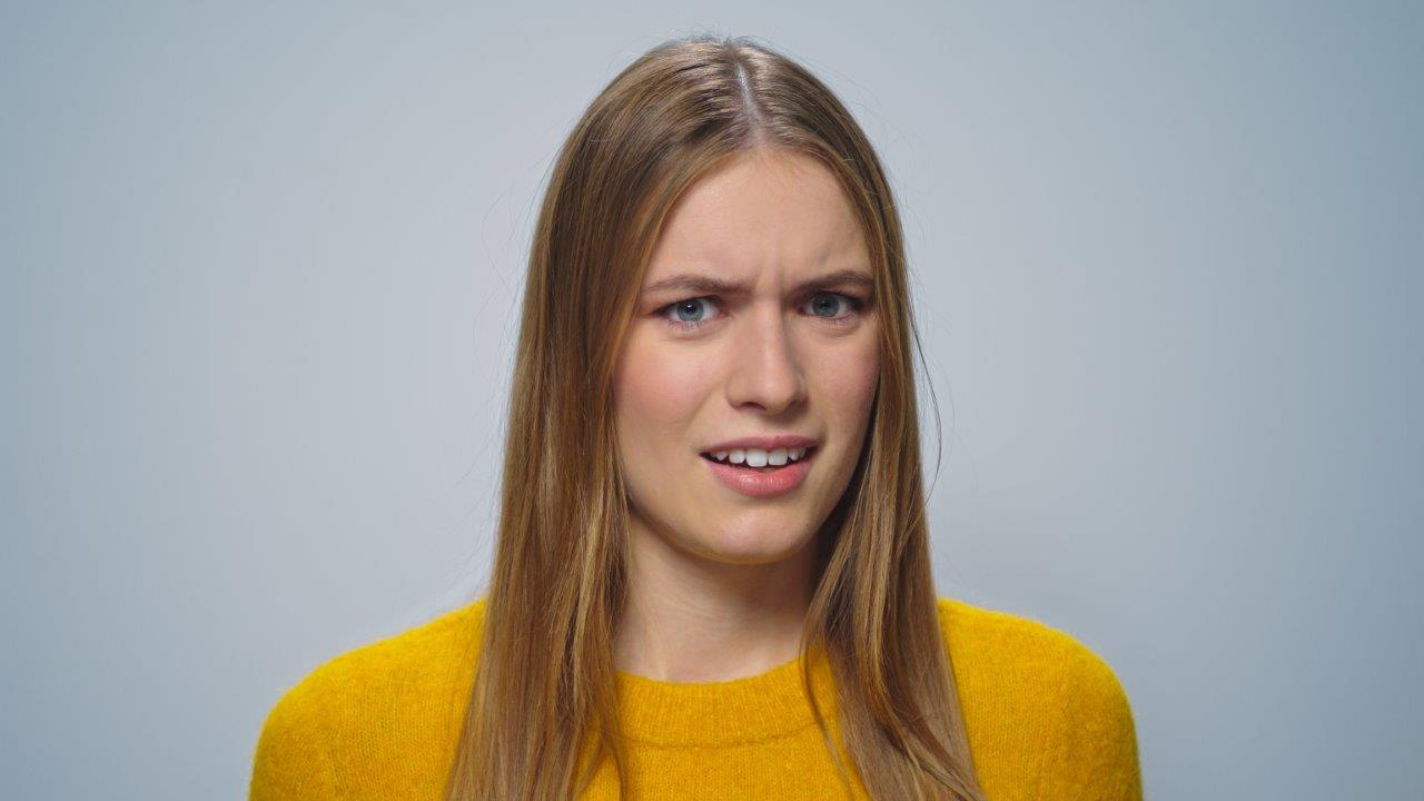 girl looking a little shocked about having a pest problem